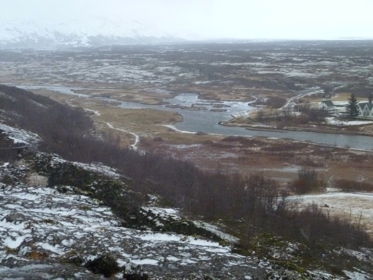 Two rocky areas are divided by a small canyon which is the result of tectonic plates moving apart in Pingvellir National Park in Accessible Iceland