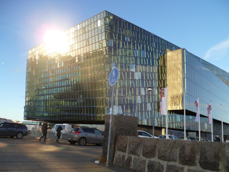 a geometric glass building is the Harpa Theater in Reykjavik Iceland 