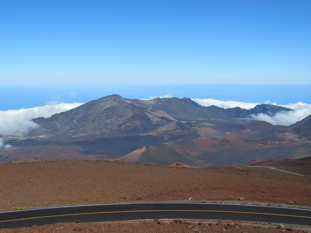 The crater at Haleakala National Park as viewed from the visitor center.  The dirt is brown with reds and darker almost black areas.