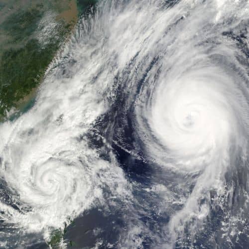 an aerial view of two swirling formations that resemble hurricanes.  Always be prepared for all types of weather on your wheelchair accessible cruise to Europe