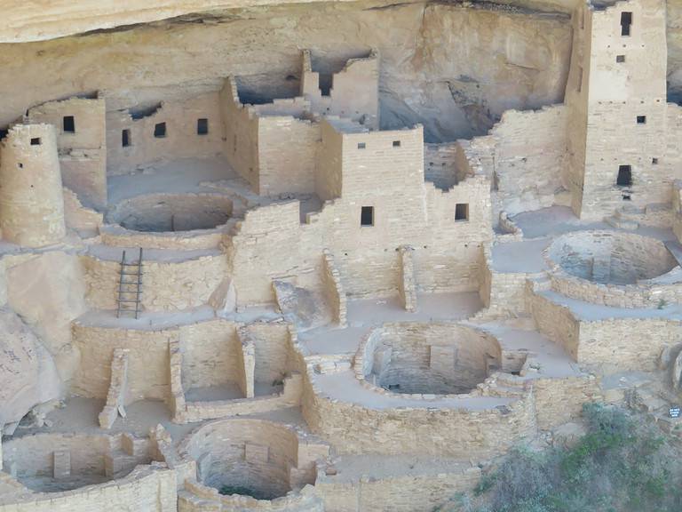 Sand colored remnants of dwellings built into the cliffs at Mesa Verde National Park