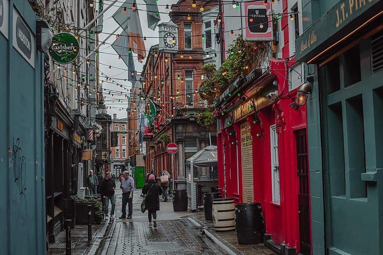 Colorful buildings line a paved alley in Dublin Ireland