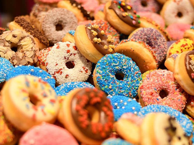 Many assorted donuts with various colors of icing and sprinkles.  Doing a donut tour in Santa Monica is one of the wheelchair accessible things to do in Los Angeles.