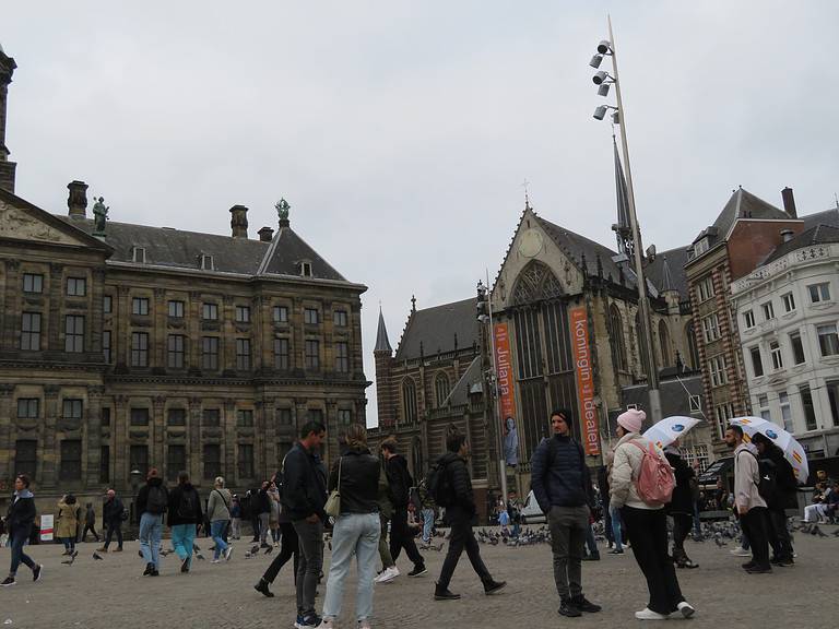 Dam Square in Amsterdam is lined with the Royal Palace and other significant buildings.