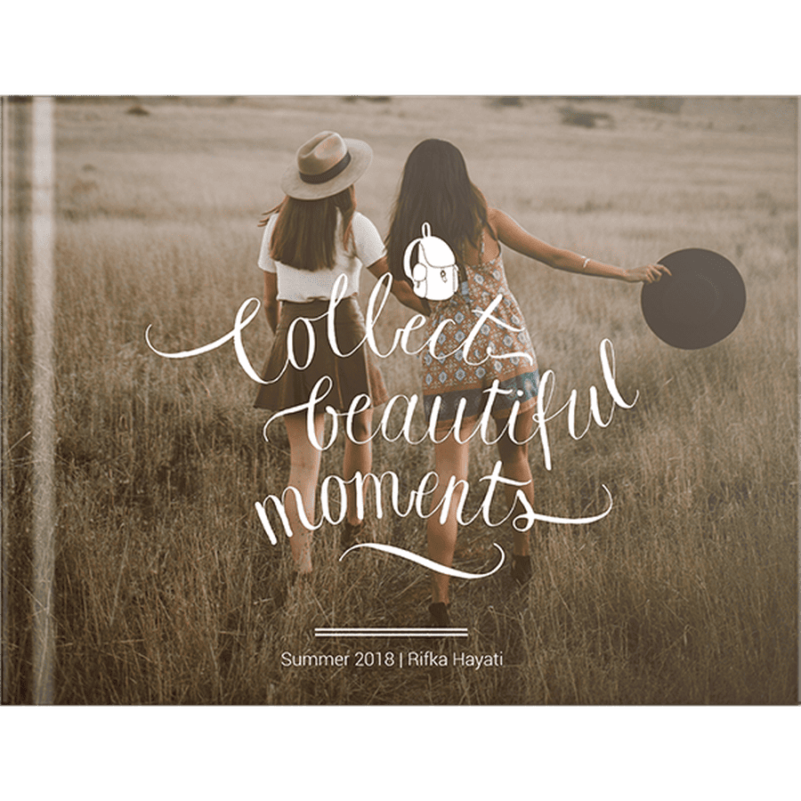 A horizontal photobook has a mother and daughter on the brown cover.  White lettering says "Collect Beautiful Moments".  A photobook is a personalized gift for national park lovers.