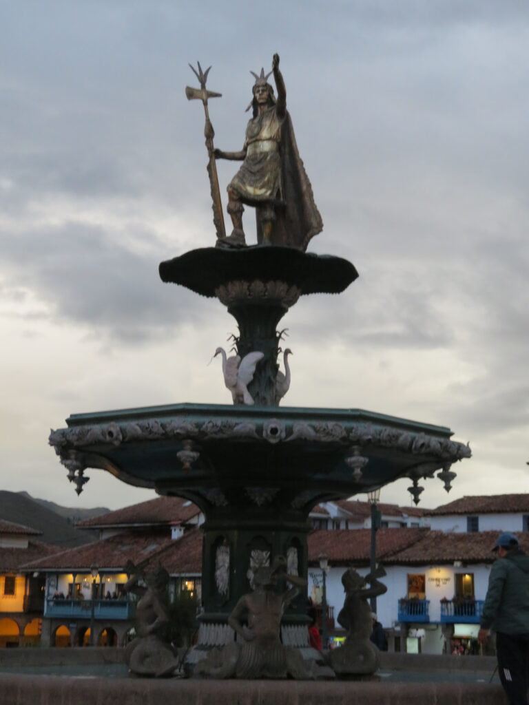 A large fountain in Cusco's main square has a silver looking statue of the Inca King Patchacute.