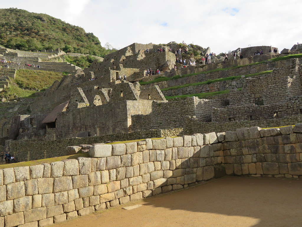 Views of the Sun Temple and other ancient stone buildings (now in ruins) can be seen perched into the side of the mountain at Machu Picchu