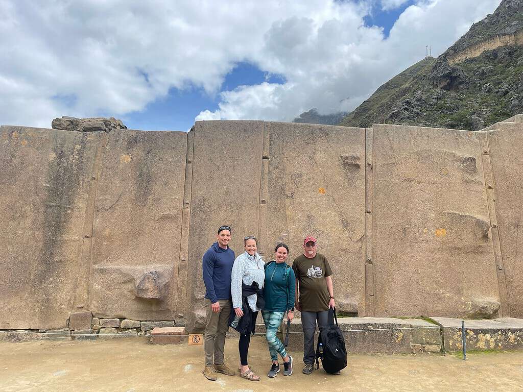 The Sun Temple at Ollantaytambo has large tan colored stones which are twice the size of people.