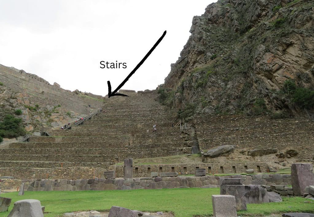 Upon entering the Inca site of Ollantaytambo you see stone terraced walls built into the hillside and a large stairway leading to the top.